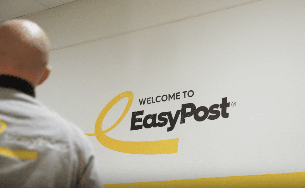 EasyPost logo - client story - customer testimonial - logo on wall